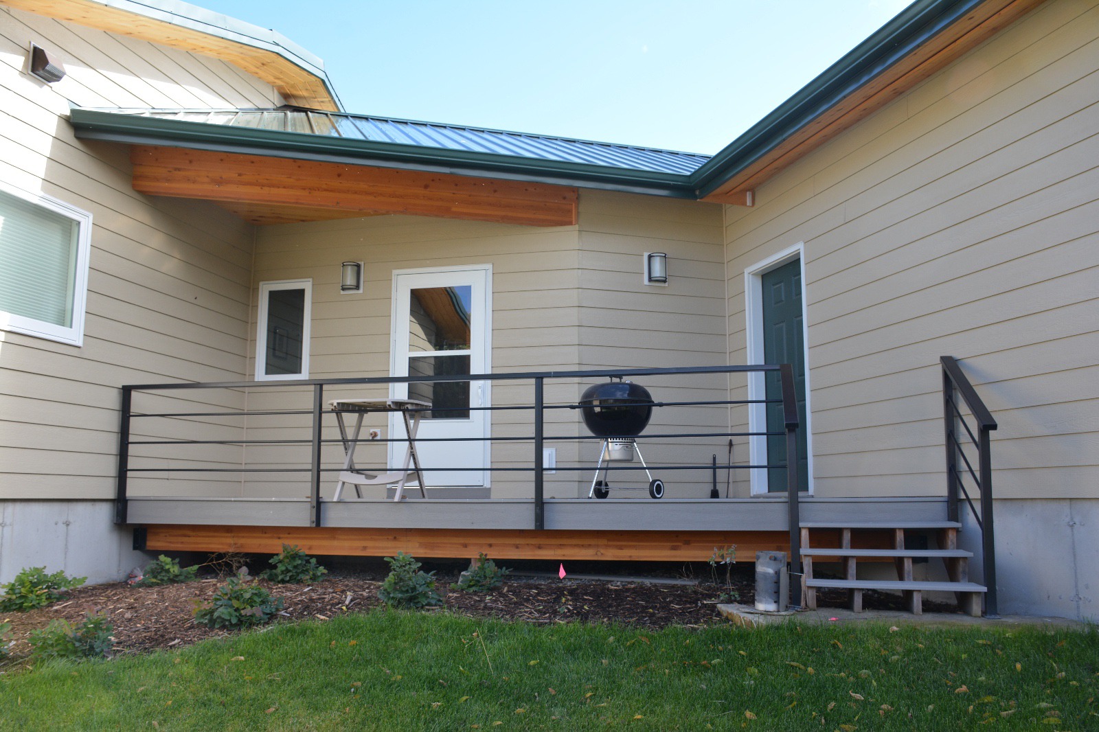 Exterior porch with custom steel handrail